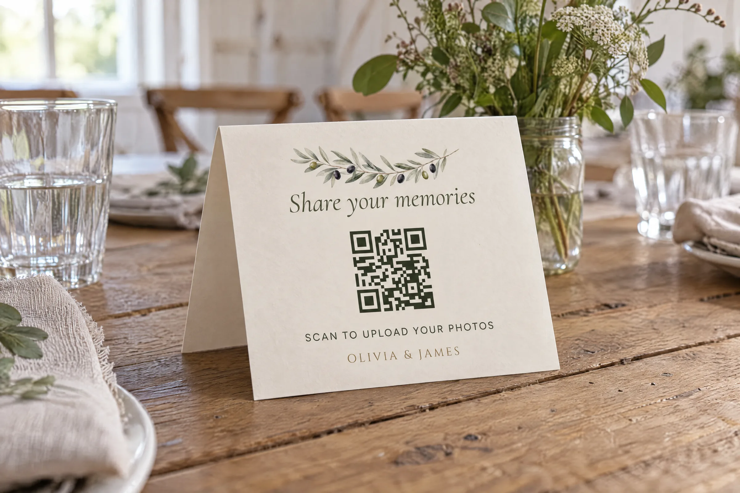 Olive Grove QR table card, folded, on a farmhouse table set for a wedding lunch